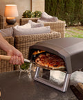 immagine-8-reber-forno-pizza-a-gas-piatto-rotante-con-borsa-e-rotella-4000w-64x44x315cm-ean-8013152700034