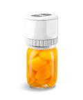 Sigillatore sottovuoto portatile con barattolo di vetro contenente frutta arancione, dispositivo bianco compatto per conservazione alimenti